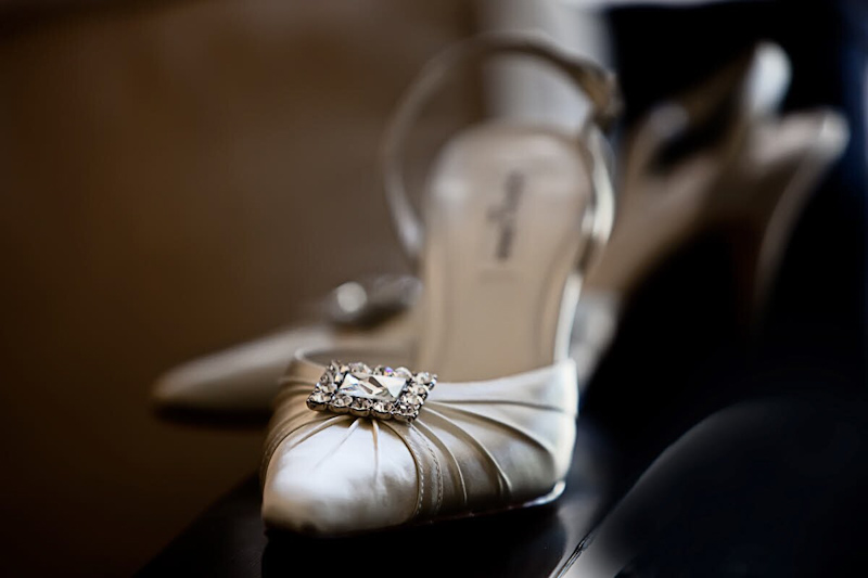 White closed toe wedding shoes with rhinestones - photo by South Africa based wedding photographer Greg Lumle